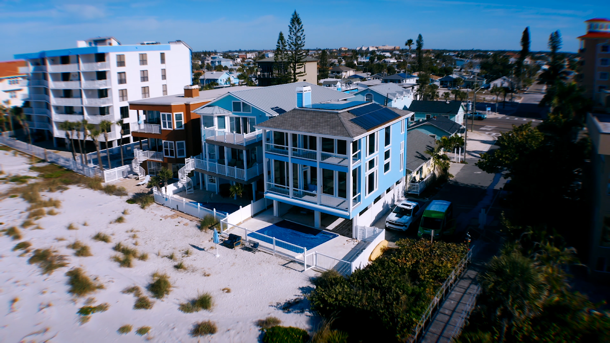Large coastal home photographed from above