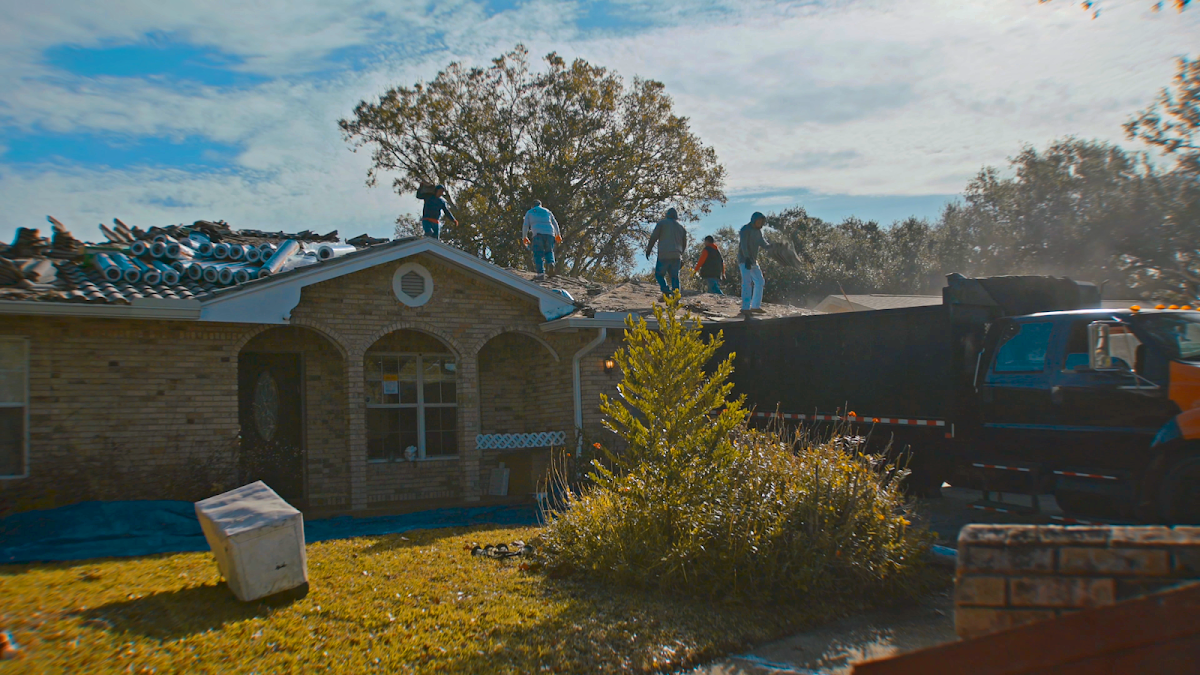 Roofing crew working on a home